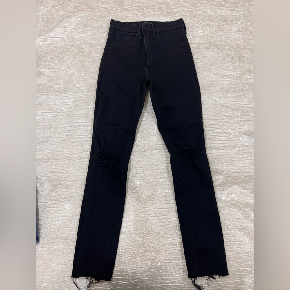 Brand new black skinny jeans with ripped details